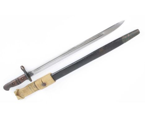 A Remington M1913 bayonet, the 43cm single edged blade marked to the ricasso 1913 5 17 Remington with Ordnance marks to the o