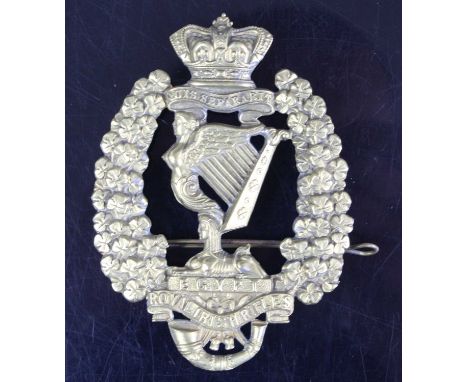 A Royal Irish Fusiliers Glengarry badge, the central Maid of Erin Harp within a wreath of shamrocks with crown above and scro