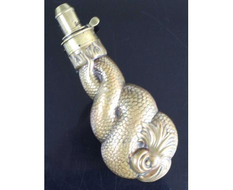 A large 19th century novelty copper powder flask, in the form of an entwined dolphin, the brass nozzle measuring 3-4 drams, s