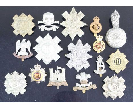 A Royal Artillery Officers Busby grenade, together with a large collection of cap badges, shoulder titles and insignia to inc