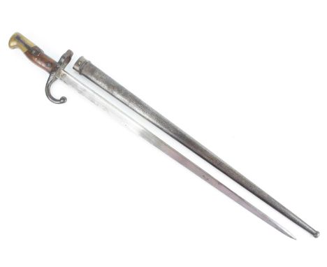 A French model 1874 Gras bayonet, the 52cm steel blade engraved to the spine and dated 1876, having a hooked quillon numbered