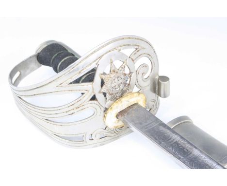A George VI sword, the 83cm blade etched with a crowned GR VI cypher above Order of the Garter and various battle honours in 
