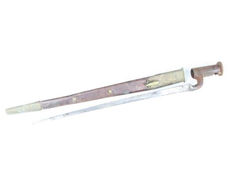 A British 1839? pattern socket bayonet, having an unmarked 40cm triangular blade, housed in a brass mounted leather scabbard,