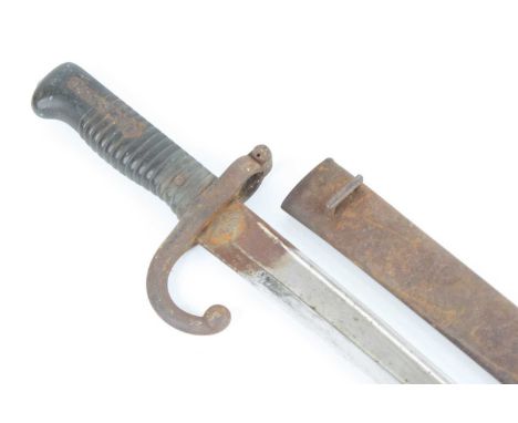 A French Model 1866 chassepot bayonet, the 57cm single edged fullered Yataghan shaped blade engraved to the back edge Mre d'a