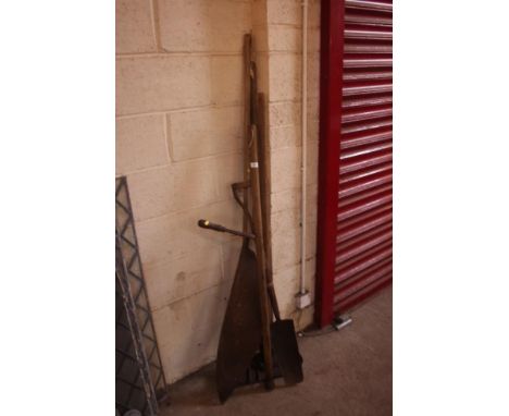 A quantity of long handled tools including a large hay knife, forks etc. 