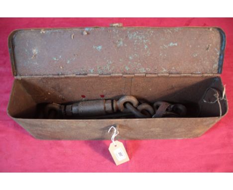 A tractor tool box and various check chains