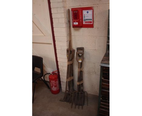 A quantity of long handled tools, including rake, forks and spades etc. 