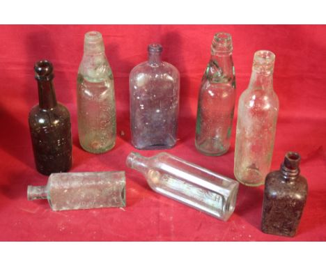 A box of vintage bottles including Ipswich and Colchester examples
