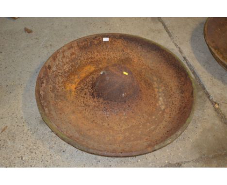 A large circular cast iron pig trough, named to "J.G. Downie of Mendlesham"