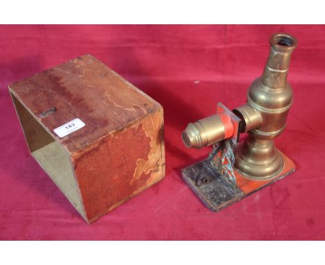 A small brass oil lamp slide projector