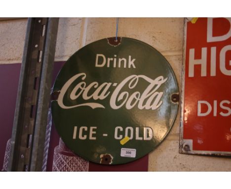 A green "Drink Coca Cola Ice Cold" circular enamel sign, 13¾" dia. approx.