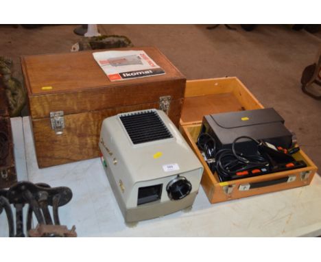 A Zeiss Icon Icomat slide projector in wooden case; and a Prestinox slide projector in box  