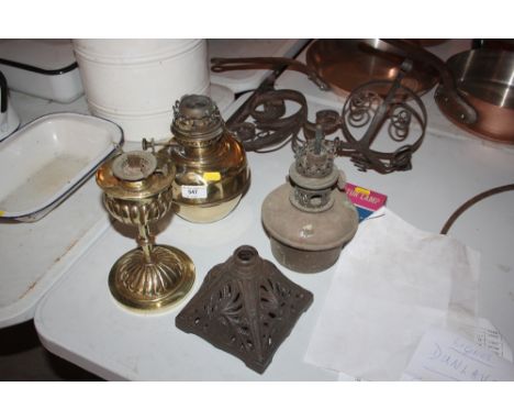 A lamp bracket; two brass lamp bases and other lamp bases