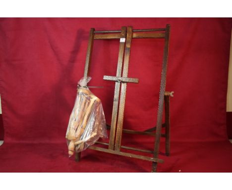 An oak adjustable easel; two small artists mannequins and two walking stick heads