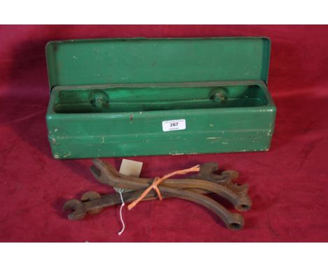 A tractor tool box and four vintage spanners