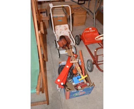 A quantity of children's beach spades; toy train; child's roller skates; small pushchair etc.