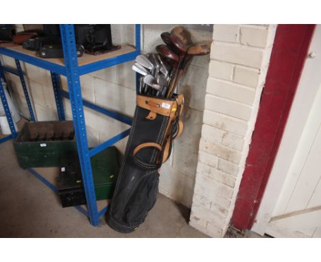 A bag of vintage golf clubs