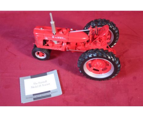 A Franklin Mint 1:12 scale Farmall model H tractor 