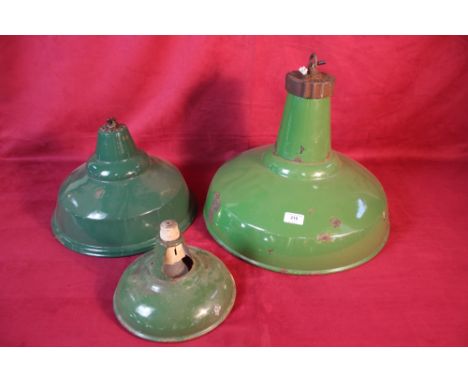 Three various sized green enamel light shades 