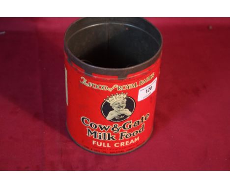 An old Cow &amp; Gate milk food tin (missing lid) and a quantity of old keys