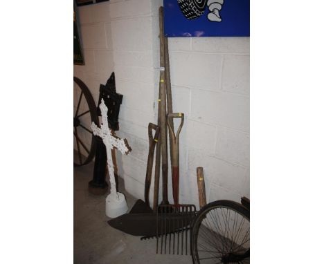 A quantity of long handled tools, including hay knife, meat fork, rake etc. 