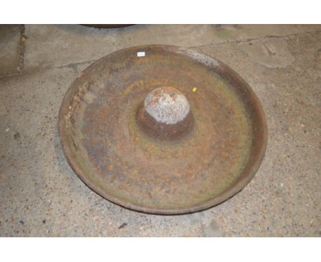 A large circular cast iron pig trough, named to "J.G. Downies of Mendlesham"