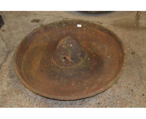 A large circular cast iron pig trough, named to "J.G. Downie of Mendlesham"