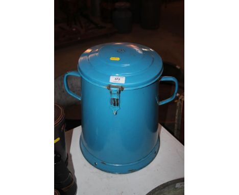A large blue enamel storage container 