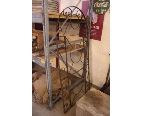 An ornate metal arched gate 72" x 35" approx.