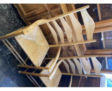 A set of eight ladder back chairs