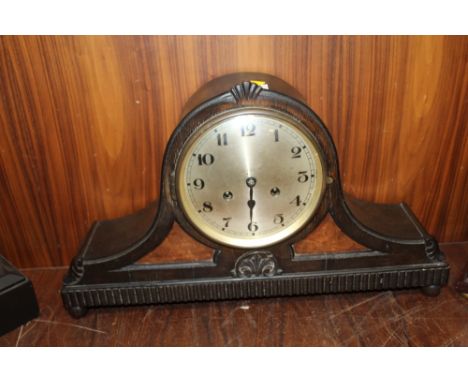 AN OAK AND WALNUT CASED GONG STRIKE MANTLE CLOCK