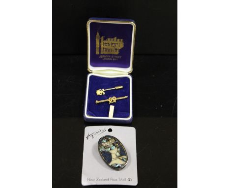 A GOLD PLATED STAFFORDSHIRE KNOT BROOCH TOGETHER WITH A STICK PIN AND A NEW ZEALAND PAUA SHELL BROOCH (3)