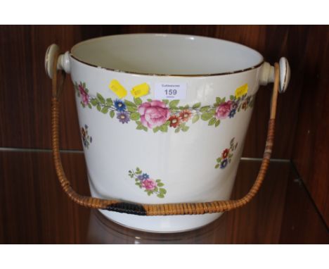 A LARGE CERAMIC WICKER HANDLED PAIL