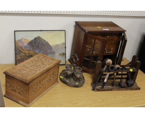 A GLAZED OAK SMOKERS CABINET, NOVELTY PIPE RACK IN THE FORM OF A FILED GATE PLUS A TREEN LIDDED BOX ETC