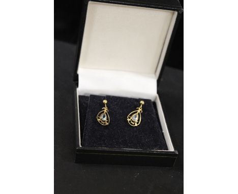 A PAIR OF VINTAGE UNMARKED YELLOW METAL DROPPER EARRINGS SET WITH BLUE TOPAZ STYLE STONES -  MISSING ONE BUTTERFLY