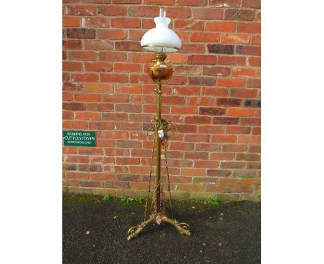 A VICTORIAN BRASS LAMP STANDARD WITH SHADE