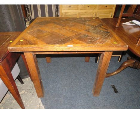 AN UNUSUAL PARQUETRY STYLE DINING TABLE