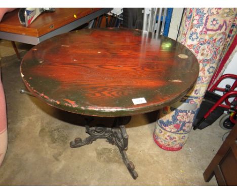 A CAST BASE CIRCULAR PUB STYLE TABLE