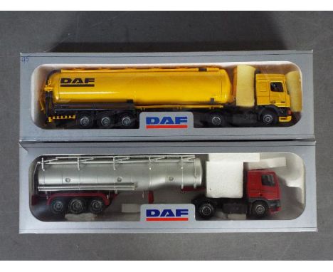 Tekno - 2 x boxed 1:50 scale DAF tanker trucks, one in yellow and one in maroon and silver. The rear ladder has broken off th