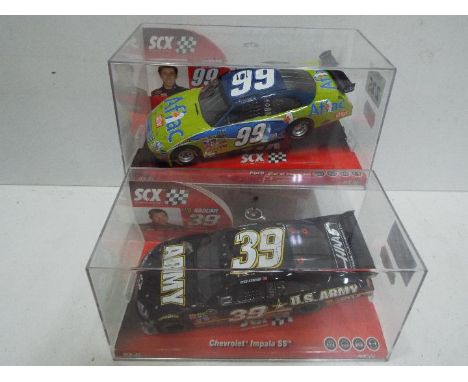 SCX - 2 x Slot Cars in 1:32 scale. # 64400 Chevrolet Impala SS U.S. Army and # 63410 Ford Nascar Edwards. Vehicles appear min