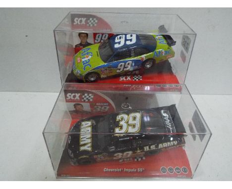 SCX - 2 x Slot Cars in 1:32 scale. # 64400 Chevrolet Impala SS U.S. Army and # 63410 Ford Nascar Edwards. Vehicles appear min