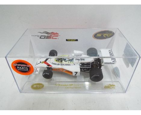 SCR / OSC - Slot Car in 1:32 scale. Chrono parts model. # 0256 / 1015 IV Sweden GP 1973 Denny Hulme. Vehicle appears mint in 