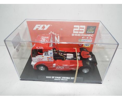 Fly Slotwings - Slot Car in 1:32 scale. # Truck 60. Man GP Spain Jarama 2019. Vehicle appears mint in perspex presentation ca