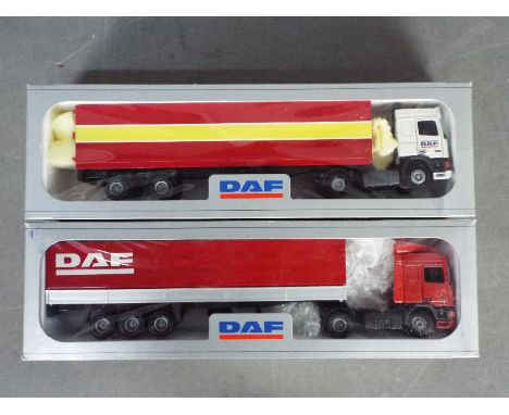 Tekno - 2 x boxed DAF trucks in 1:50 scale. The red and yellow trailer has a broken rear door hinge. Both models appear other