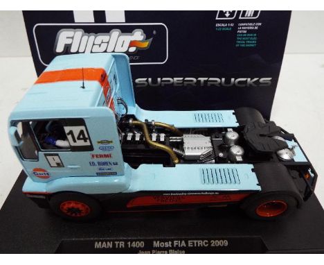 FlySlot - Slot Car model in 1:32 Scale - Supertrucks. # 203102 MAN TR 1400 FIA ETRC 2009. Driver Jean Pierre Blaise. Appears 