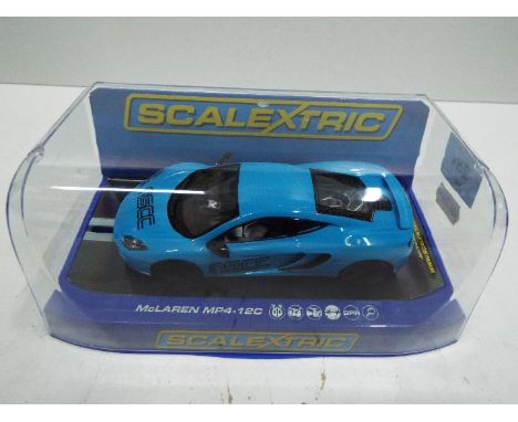 NSCC Scalextric - Slot Car in 1:32 scale. # 3332 McLaren MP4.. Vehicle appears mint in perspex presentation case. Light stora