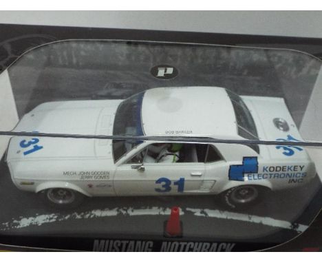 Pioneer - Slot Car in 1:32 Scale - Ref. P010. '68 Mustang Notchback. Appears mint in presentation case, with storage wear to 