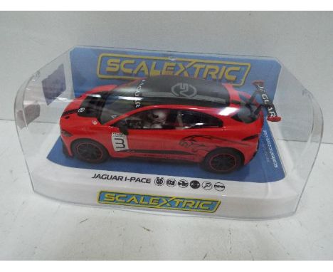 Scalextric - Slot Car in 1:32 scale. # C4042 Jaguar I-Pace. Vehicle appears mint in perspex presentation case. Light storage 