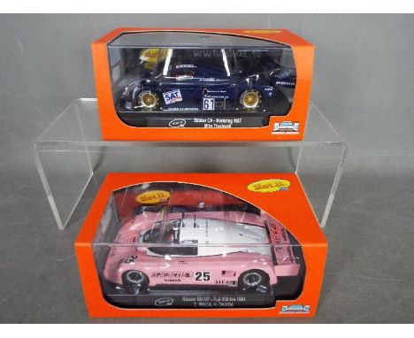 Slot.it. - 2 x Slot Cars in 1:32 scale. # CA06i Sauber C9 and # CA28g Nissan R91VP. Vehicles appear mint in perspex presentat