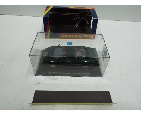 NSCC Scalextric - Slot Car in 1:32 scale. Jaguar XJ220 Special Edition for NSCC 200th Anniversary. Vehicle appears mint in pe